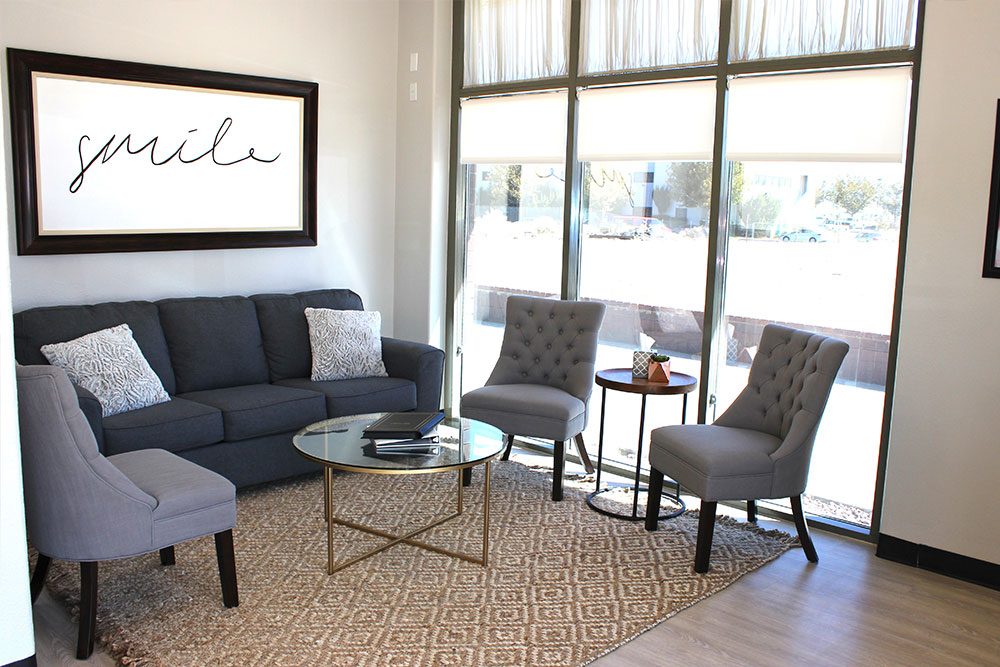 exceptional dentistry waiting room with three single couches, and a three person couch